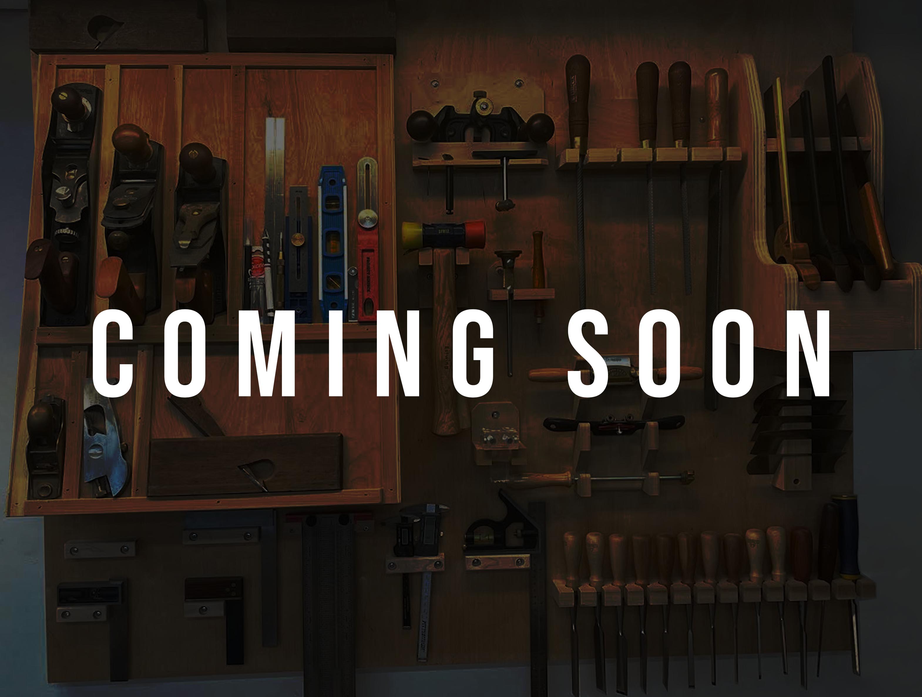 Different woodworking tools hanging on the wall.
